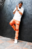 Model wearing mercury orange stacked jeans